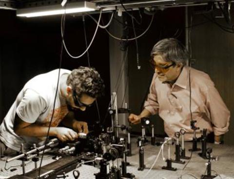 Nitin Samarth, right, and student Jyotirmay Dwivedi, both part of Q-NEXT, set up optical measurements of nitrogen vacancy center