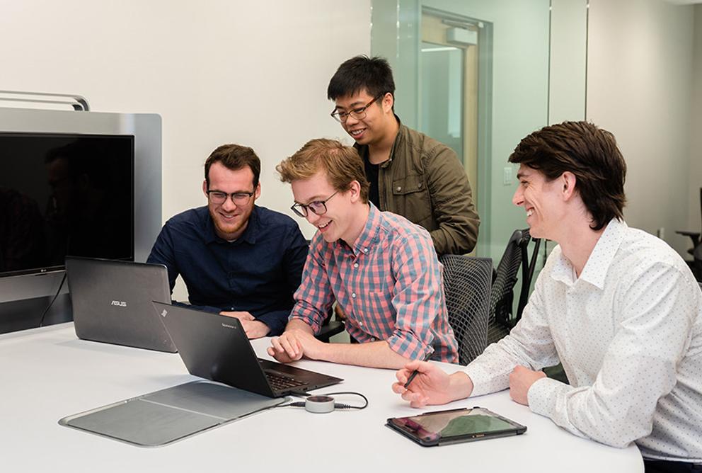 Jason Munro, a doctoral student in materials science and engineering, center, says he works in the field of computational materi